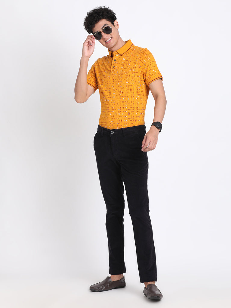 Young blond guy dressed in mustard color sweater and black pants is posing  in the studio on the beige background Stock Photo by ©Leika_production  243802714